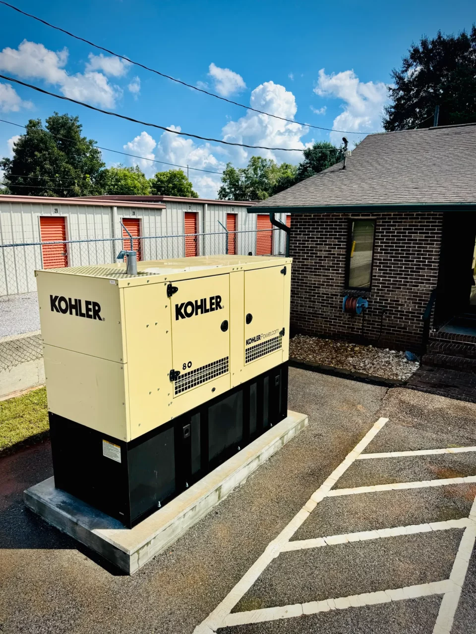 Kohler diesel generator set on a new concrete pad at a commercial property