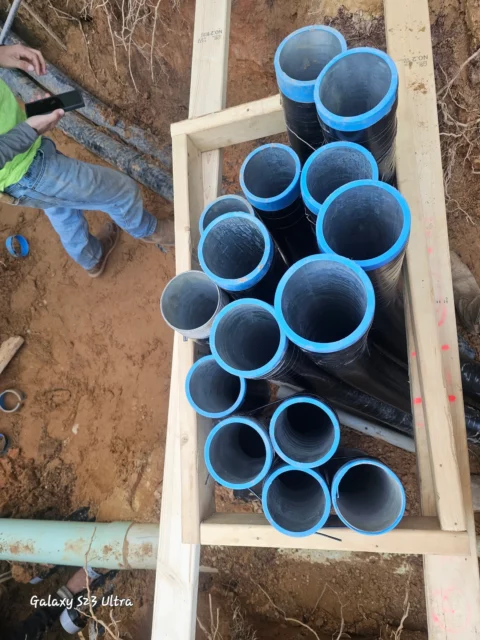 Conduit stub-ups boxed in timber forms before concrete