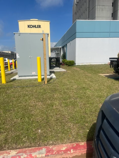 Generator and transfer switch enclosure installed on a new concrete pad